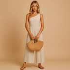Women’s asymmetrical evening jumpsuit with wide legs and one-shoulder design in beige, perfect for galas, cocktail parties, and formal events.