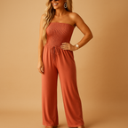 Women’s orange off-shoulder summer jumpsuit with soft fabric, practical pockets, and a flattering fit. Perfect for casual outings and summer parties.