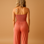 Women’s orange off-shoulder summer jumpsuit with soft fabric, practical pockets, and a flattering fit. Perfect for casual outings and summer parties.