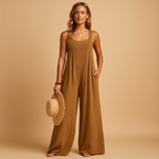 Women’s summer jumpsuit with high waist, wide legs, and button details. Lightweight and breathable design, perfect for casual or evening looks.